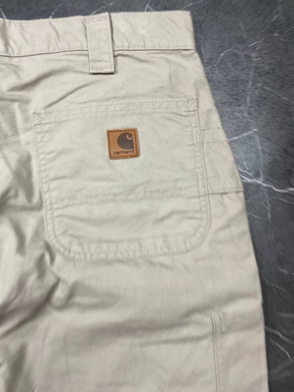 Carhartt beige work shorts 36-inch waist with multiple pockets and hammer loop detail.
