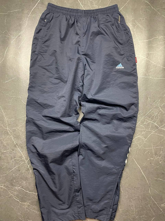 Adidas girls tracksuit navy blue with white stripes, full zip jacket and elastic pants.