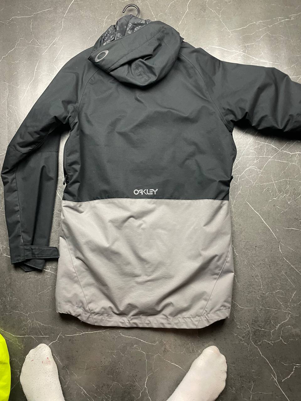 Oakley insulated hooded jacket black and grey with logo on chest and hood.