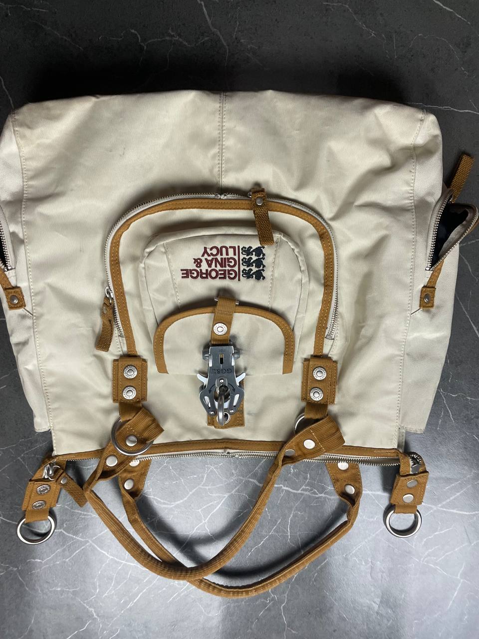 George Gina & Lucy beige canvas shoulder bag with brown straps and embroidered logo.