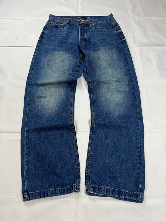 Rocawear blue denim loose fit jeans with faded effect and embroidered back pocket details.