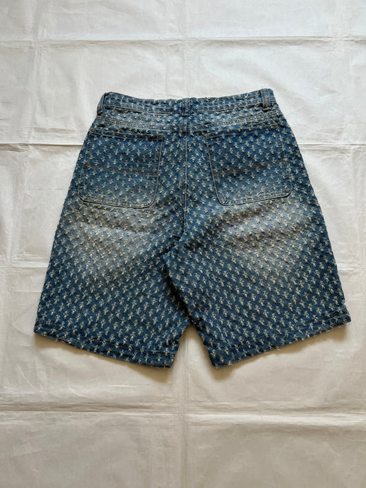Based NY blue baggy fit denim shorts with distressed pattern and brass rivet details.