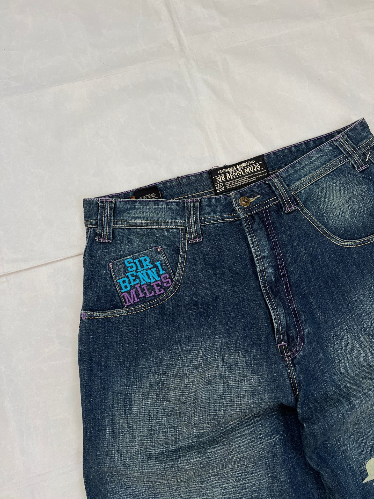 SIR BENNI MILES blue denim shorts with embroidered logos and faded wash, 100% cotton.