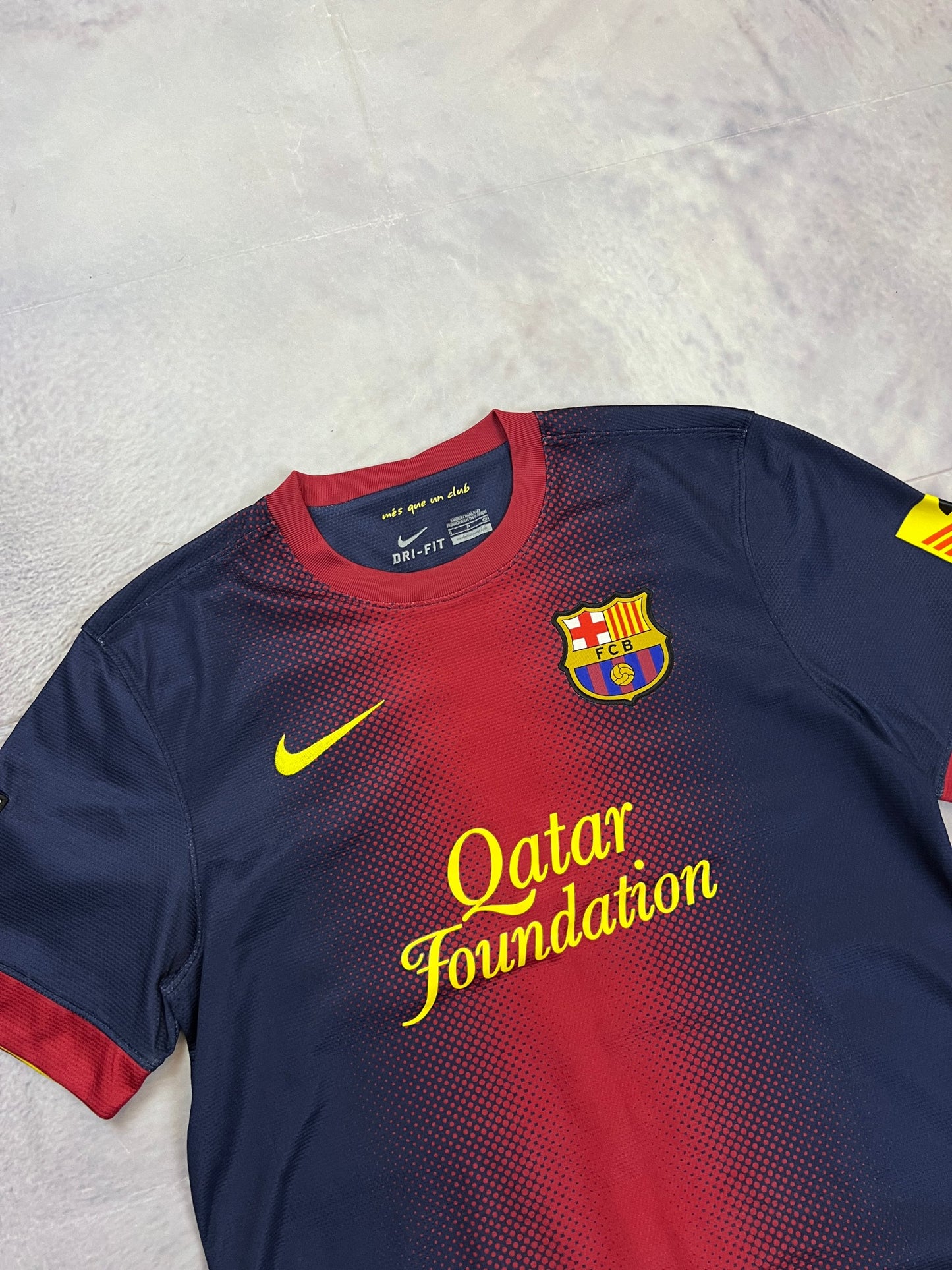 Nike FC Barcelona navy and red football shirt with Qatar Foundation logo and La Liga patches.