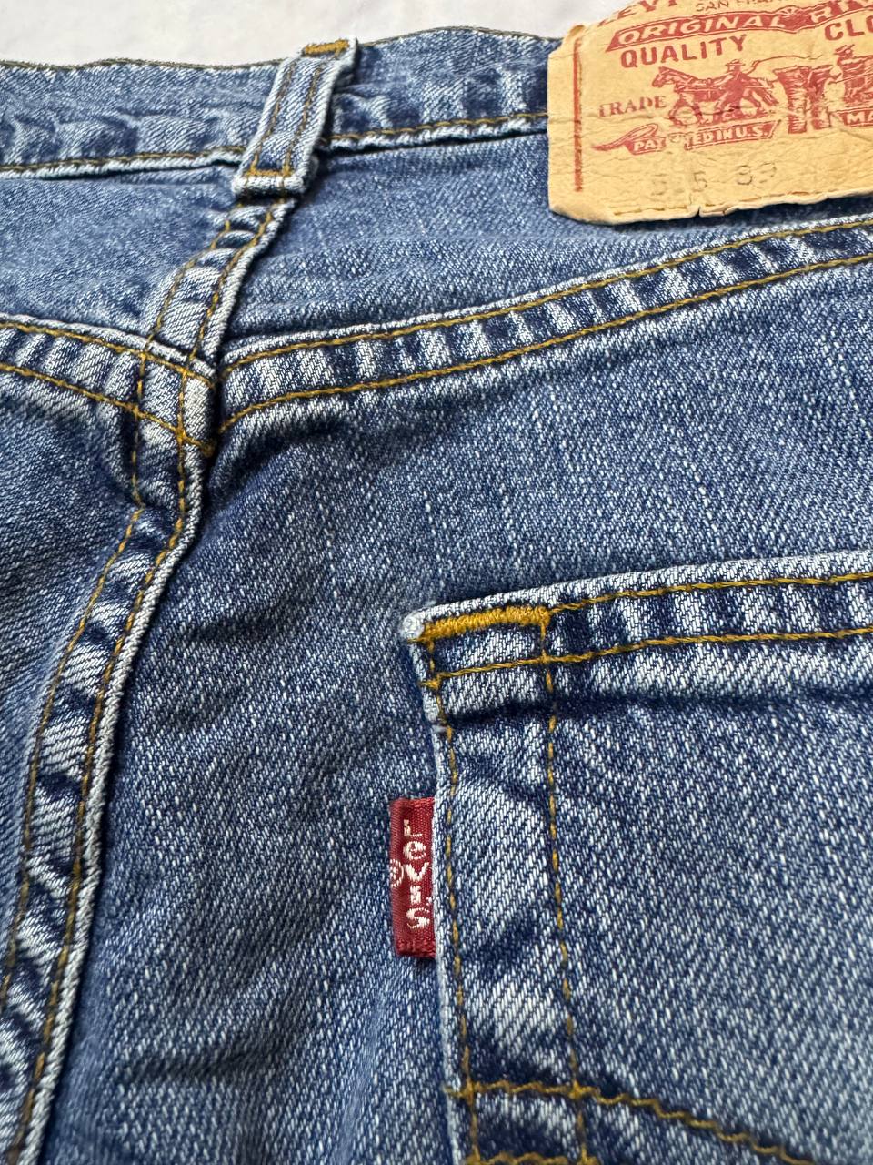 Levi's blue denim jeans with classic five-pocket design and iconic patch on waistband.