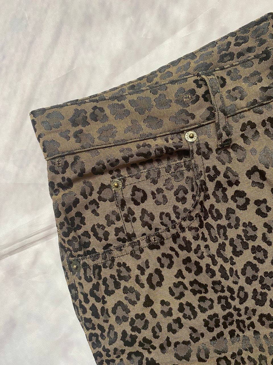 Iceberg brown leopard print trousers with front pockets and metal button closure.