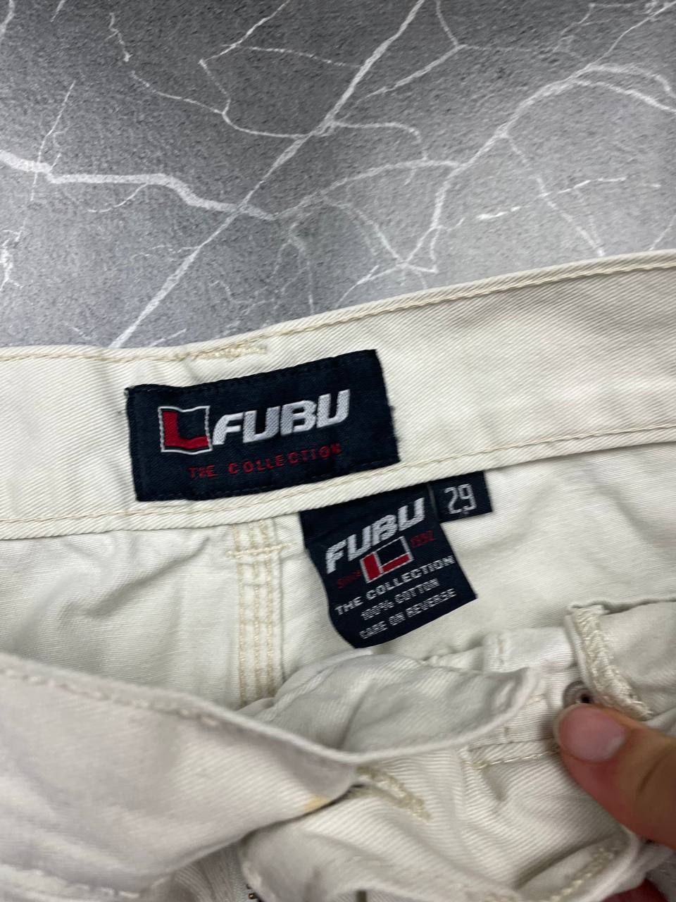 FUBU white cargo shorts 100% cotton with multiple pockets and detailed branding.