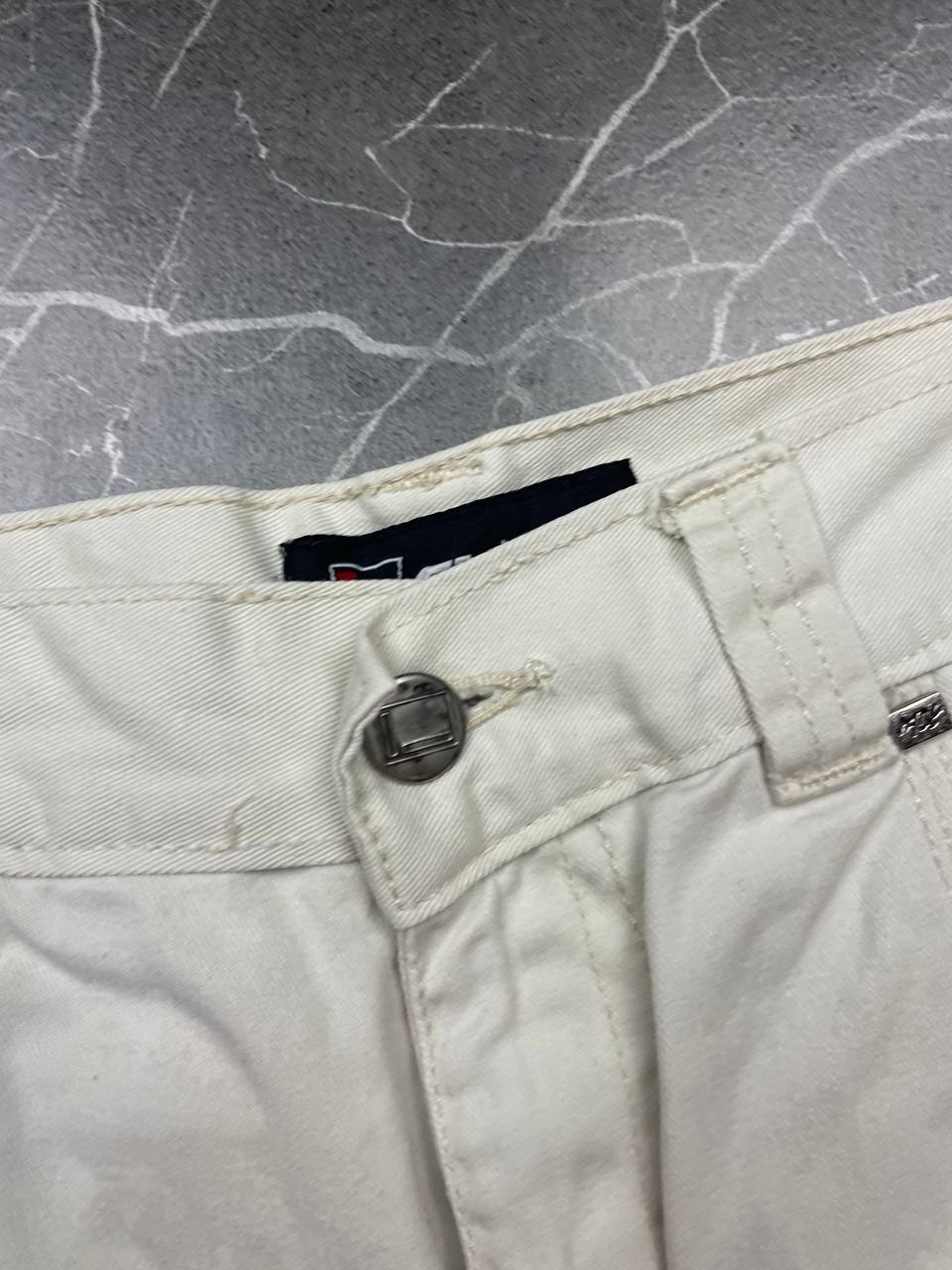 FUBU white cargo shorts 100% cotton with multiple pockets and detailed branding.