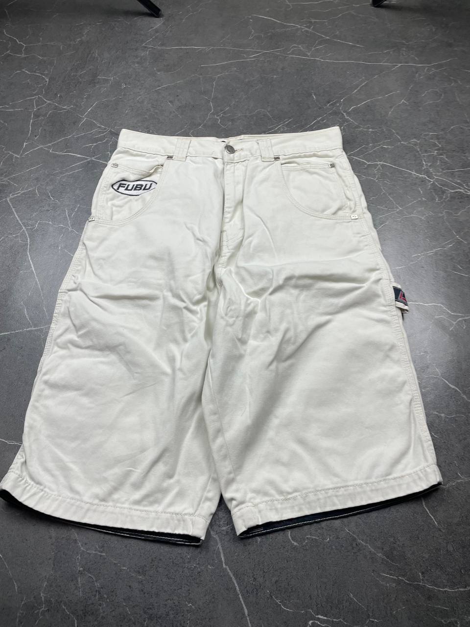 FUBU white cargo shorts 100% cotton with multiple pockets and detailed branding.