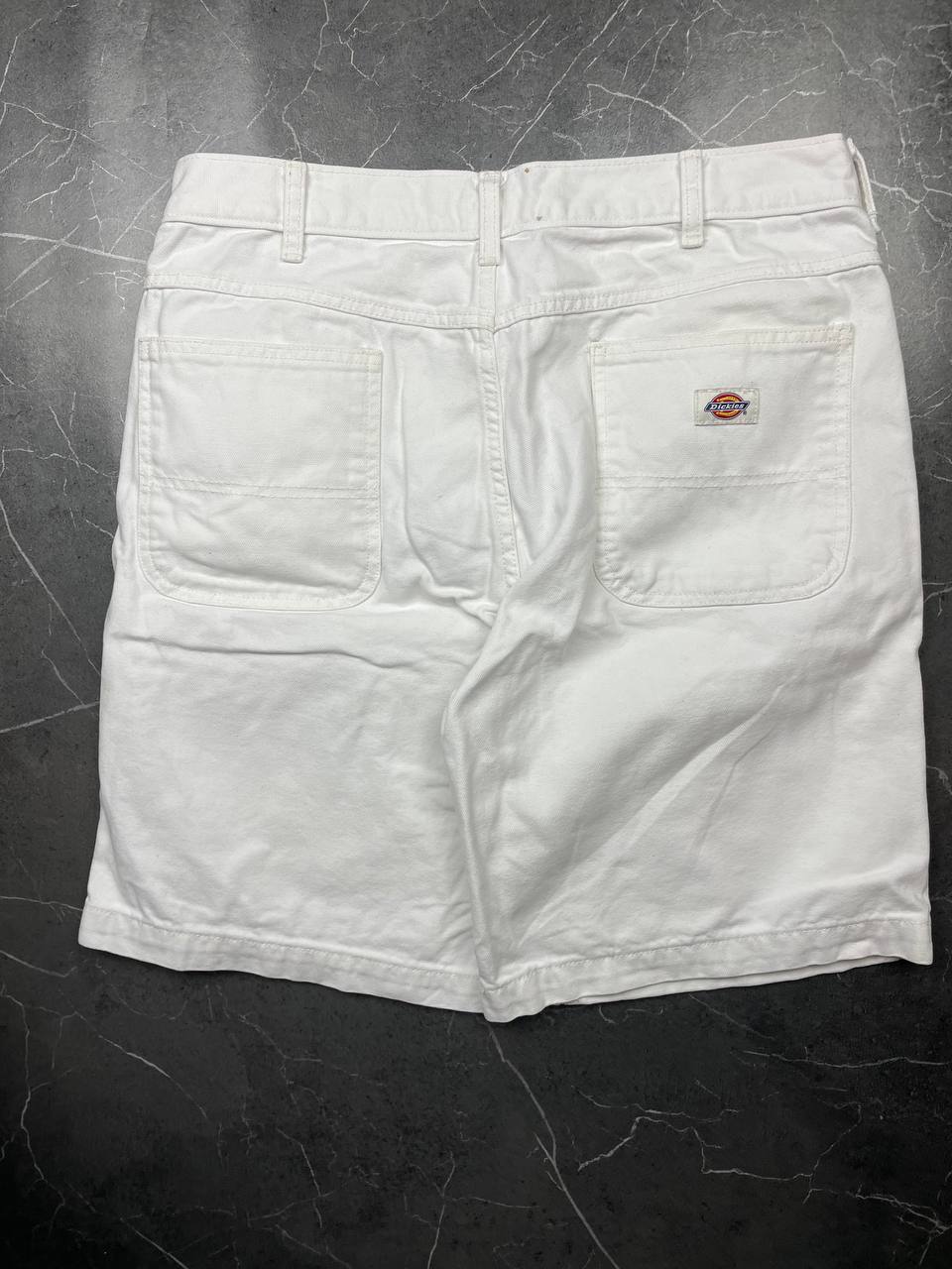 Dickies white cotton work shorts with logo on back pocket and waistband label.