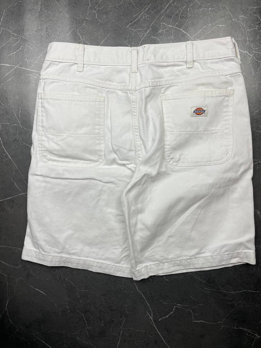 Dickies white cotton work shorts with logo on back pocket and waistband label.