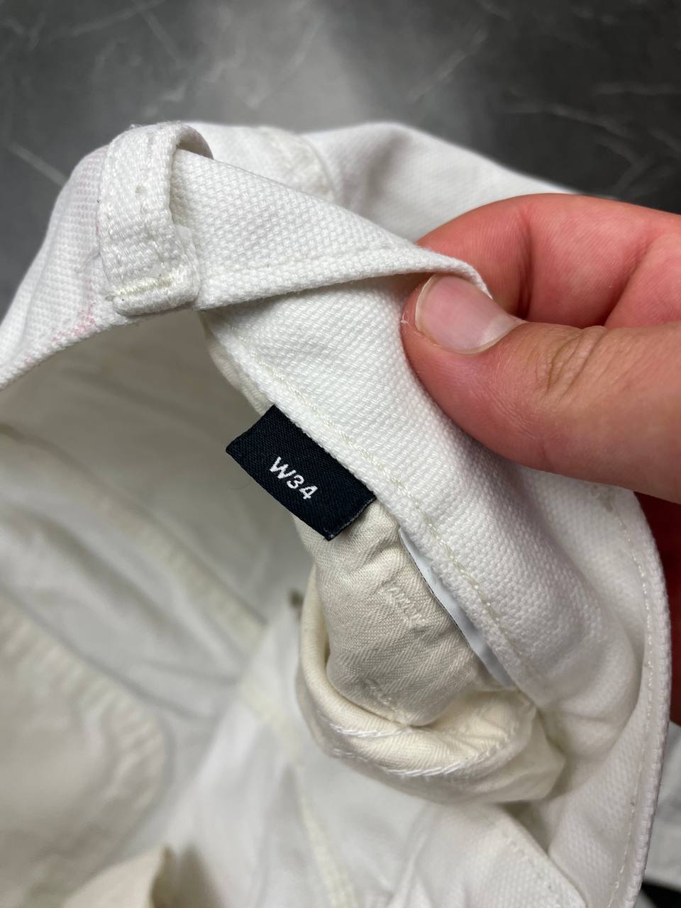 Dickies white cotton work shorts with logo on back pocket and waistband label.