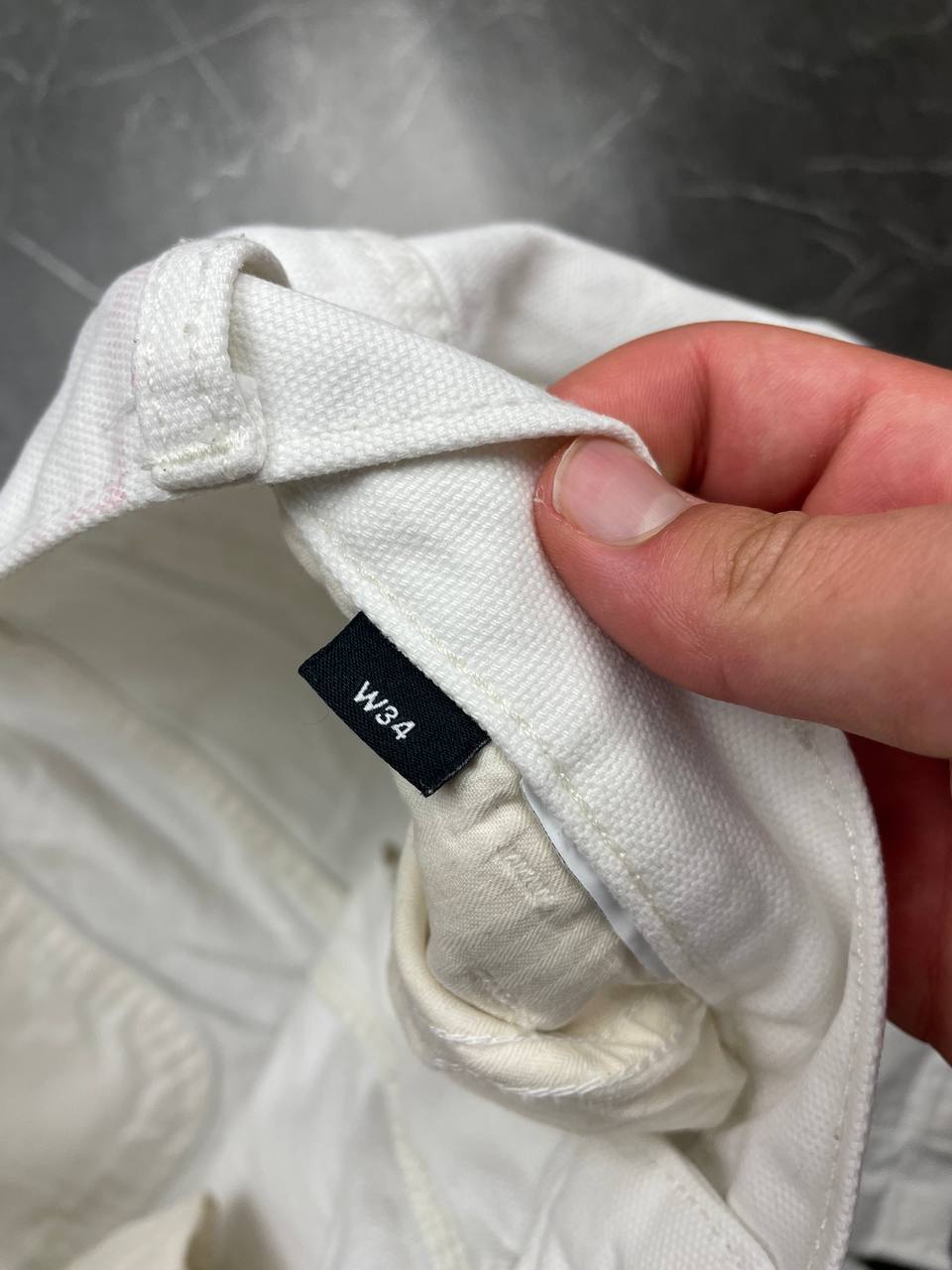 Dickies white cotton work shorts with logo on back pocket and waistband label.