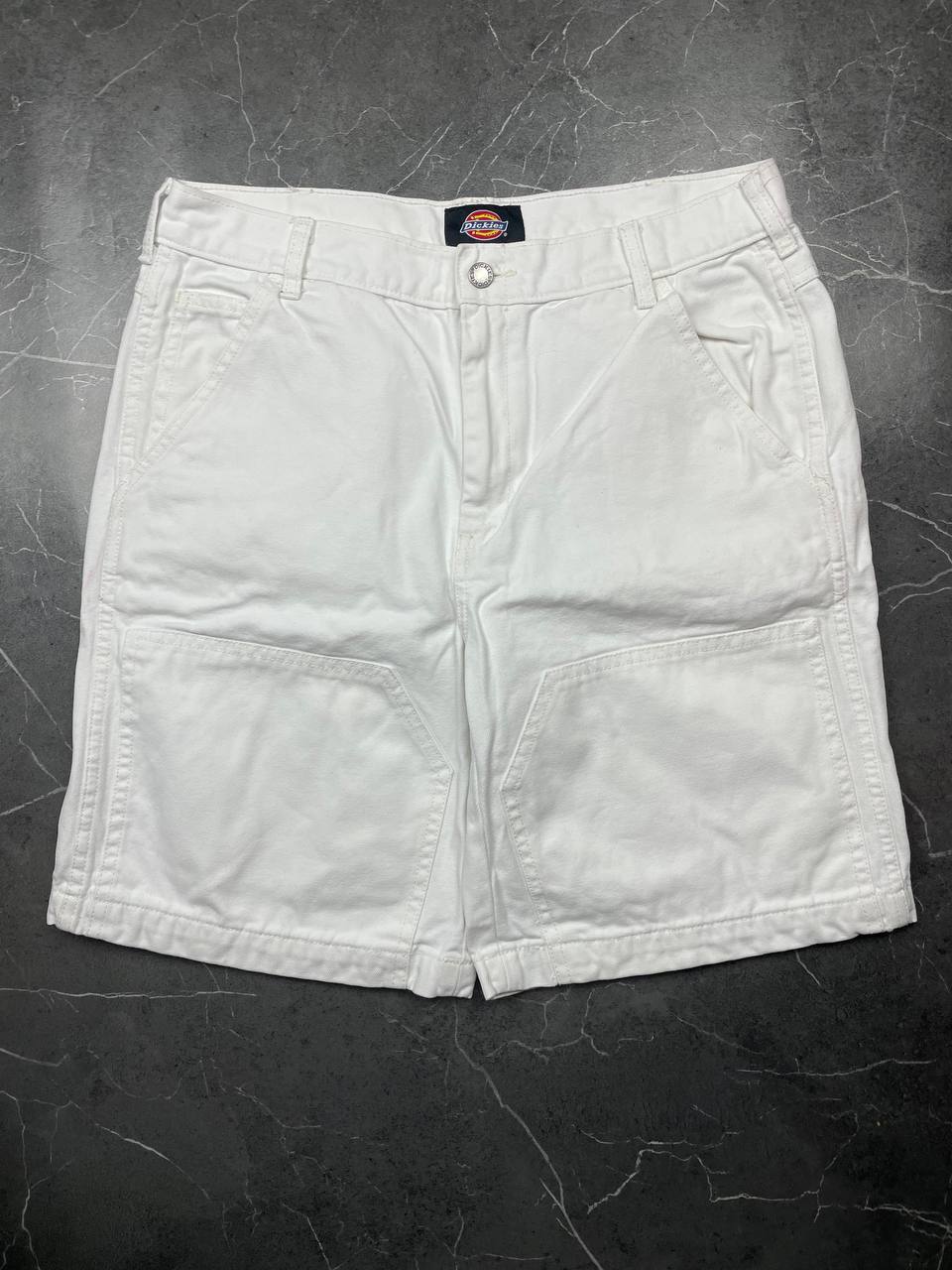 Dickies white cotton work shorts with logo on back pocket and waistband label.