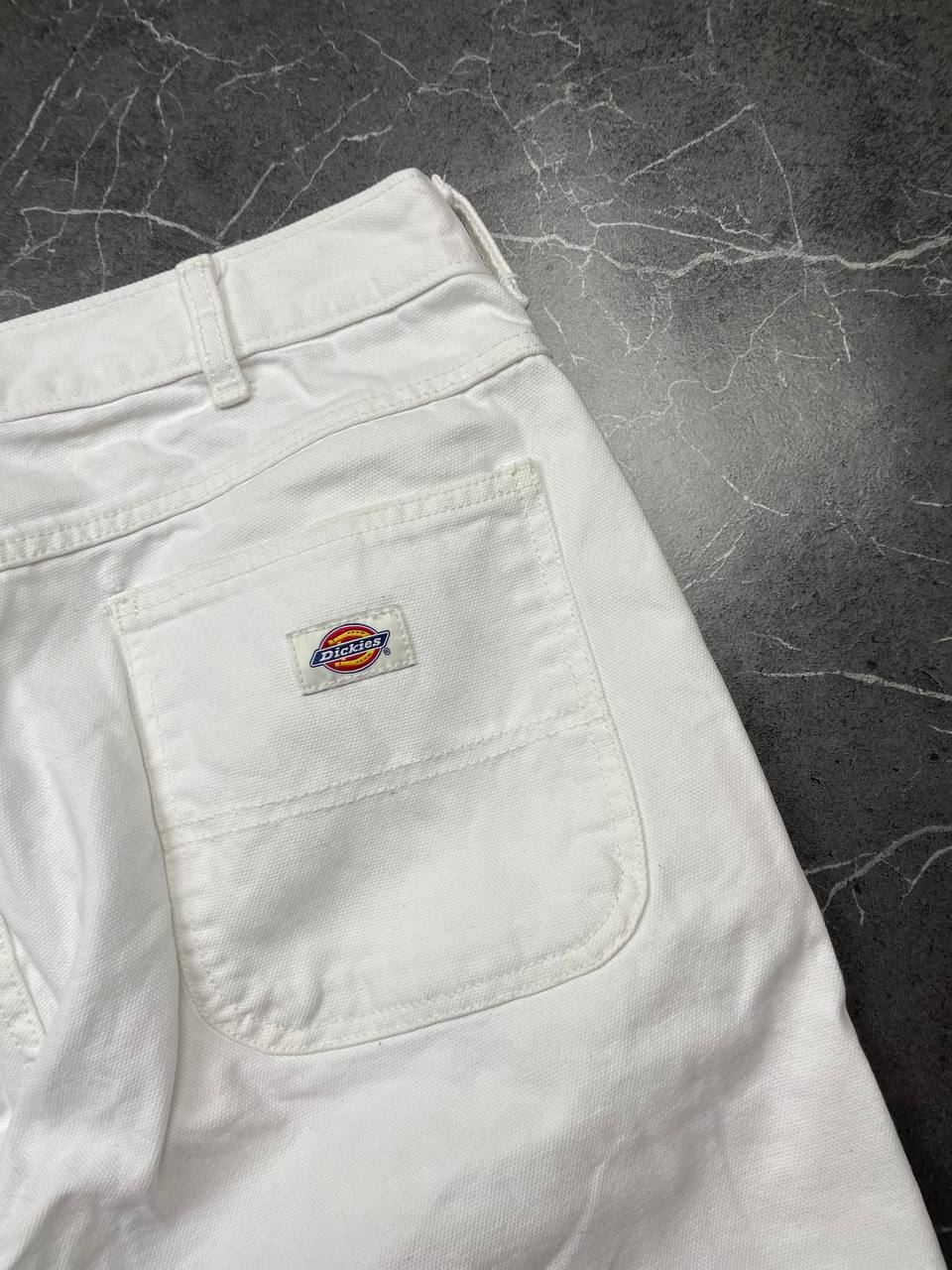 Dickies white cotton work shorts with logo on back pocket and waistband label.