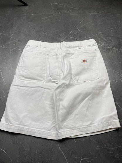 Dickies white cotton work shorts with logo on back pocket and waistband label.