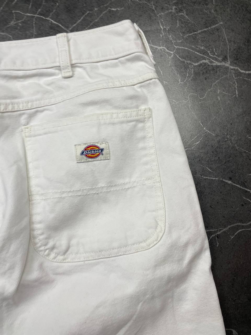 Dickies white cotton work shorts with logo on back pocket and waistband label.