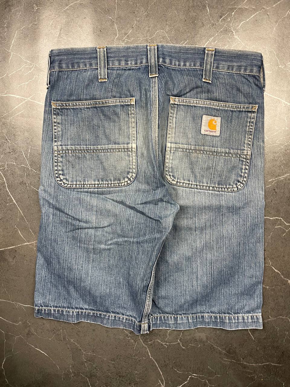 Carhartt blue denim work shorts size 32 with button closure and large back pockets.