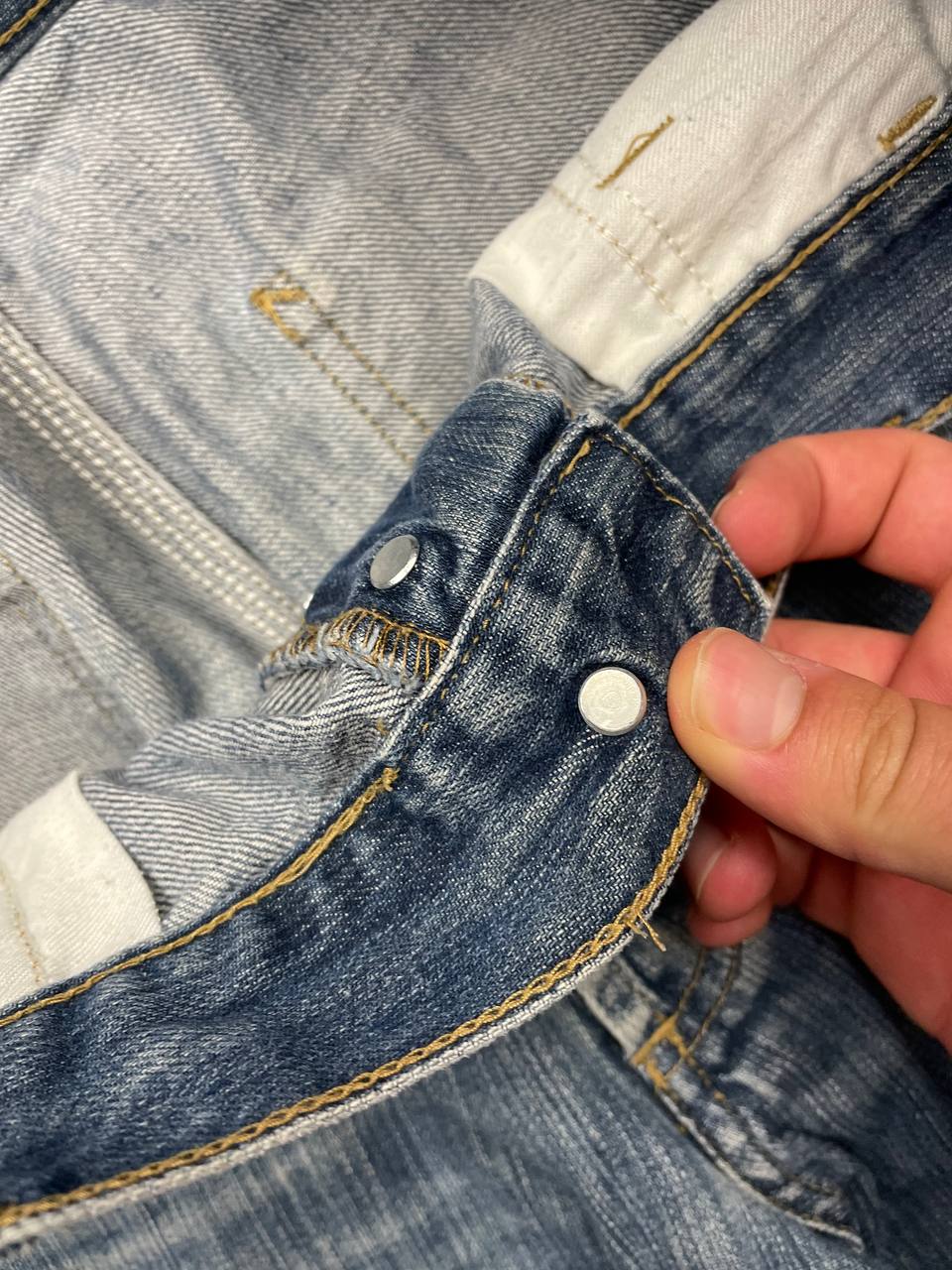 Carhartt blue denim work shorts size 32 with button closure and large back pockets.