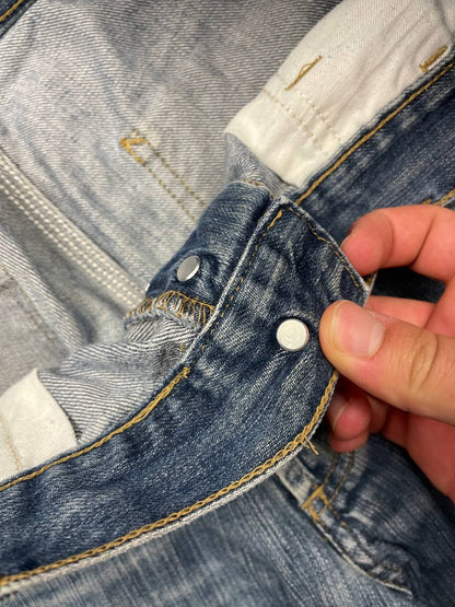 Carhartt blue denim work shorts size 32 with button closure and large back pockets.