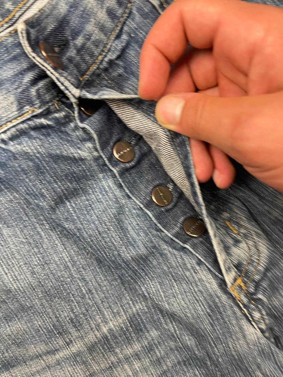 Carhartt blue denim work shorts size 32 with button closure and large back pockets.