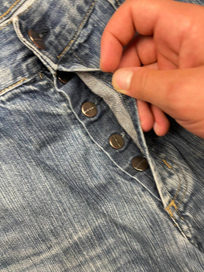 Carhartt blue denim work shorts size 32 with button closure and large back pockets.