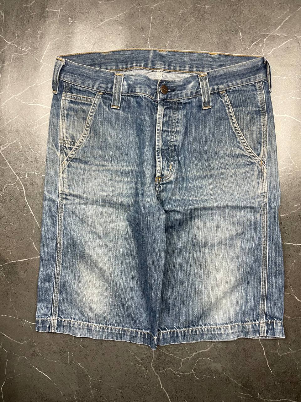 Carhartt blue denim work shorts size 32 with button closure and large back pockets.