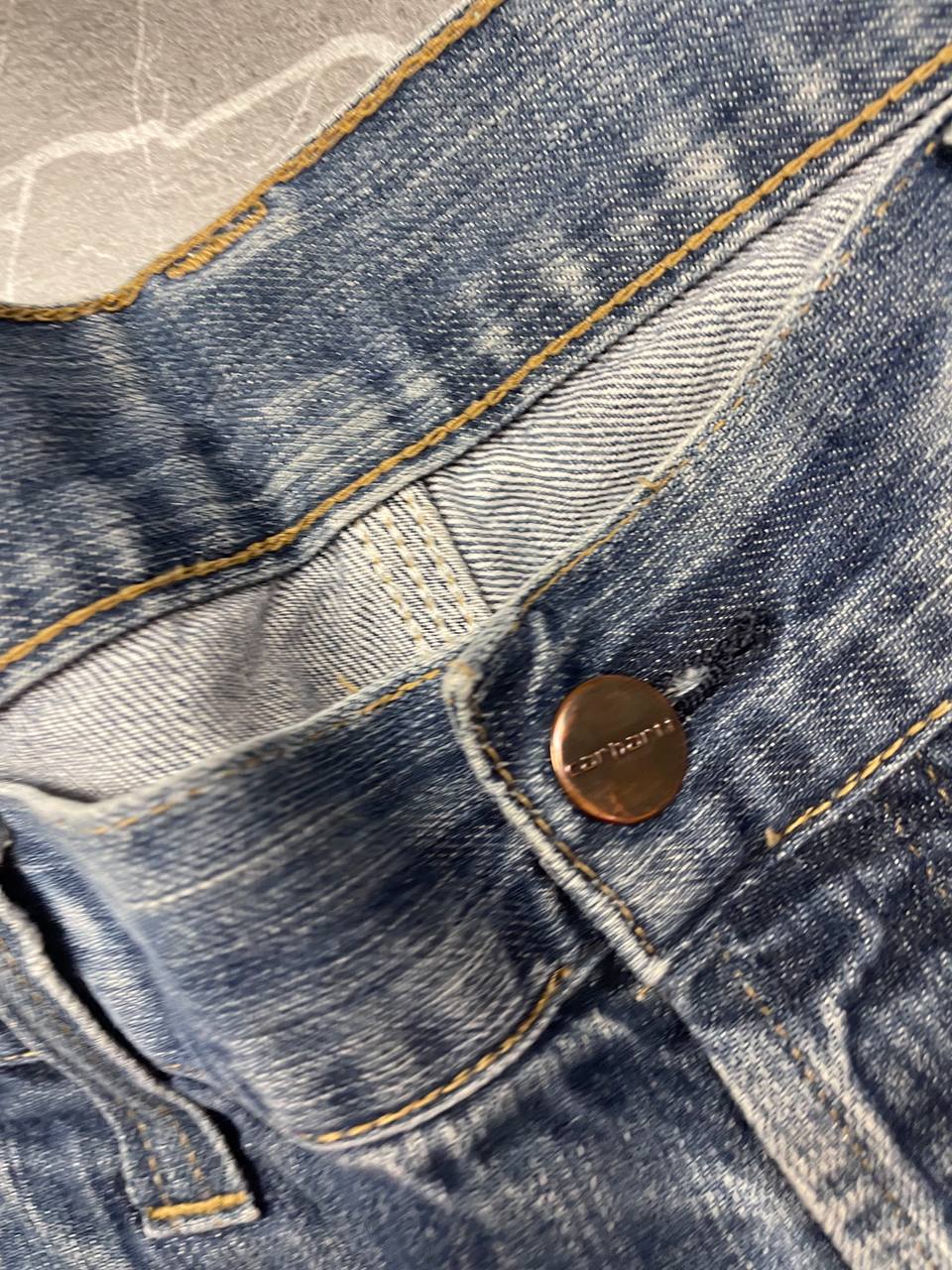 Carhartt blue denim work shorts size 32 with button closure and large back pockets.