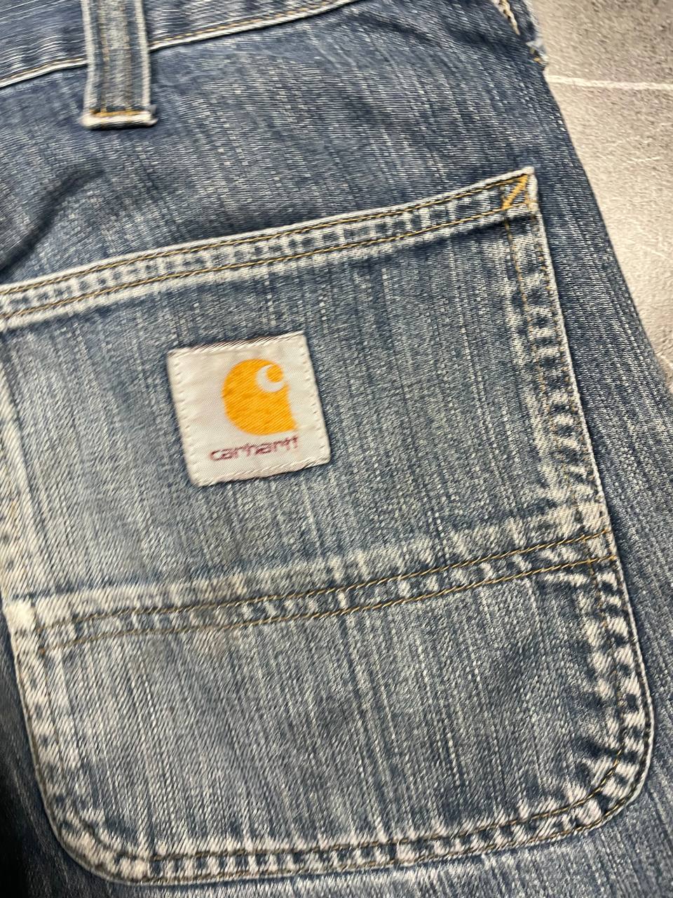 Carhartt blue denim work shorts size 32 with button closure and large back pockets.