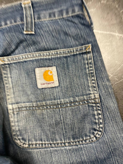 Carhartt blue denim work shorts size 32 with button closure and large back pockets.