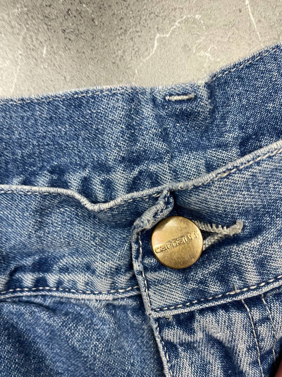 Carhartt blue denim skirt with multiple pockets and hammer loop detail.