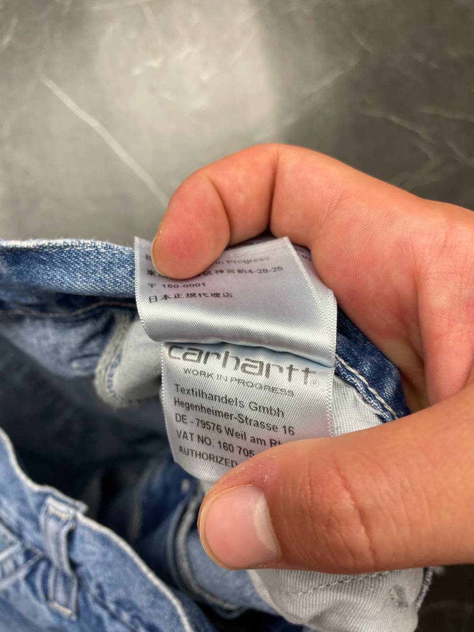 Carhartt blue denim skirt with multiple pockets and hammer loop detail.