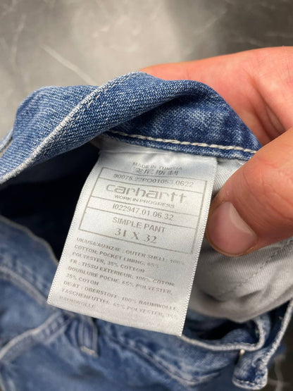 Carhartt blue denim skirt with multiple pockets and hammer loop detail.