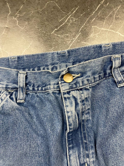 Carhartt blue denim skirt with multiple pockets and hammer loop detail.