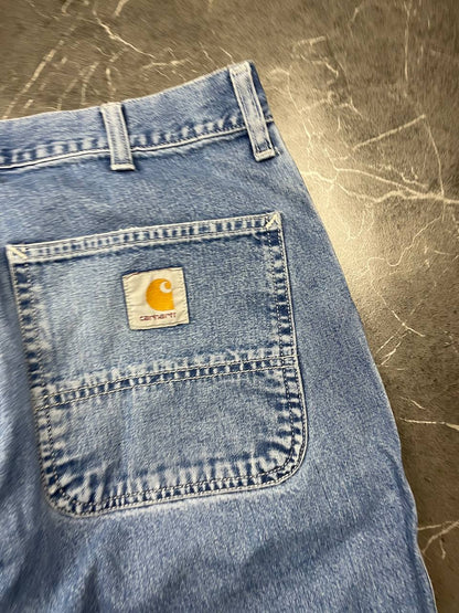 Carhartt blue denim skirt with multiple pockets and hammer loop detail.