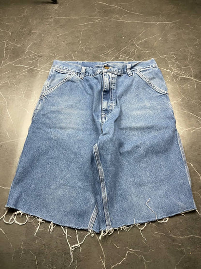 Carhartt blue denim skirt with multiple pockets and hammer loop detail.