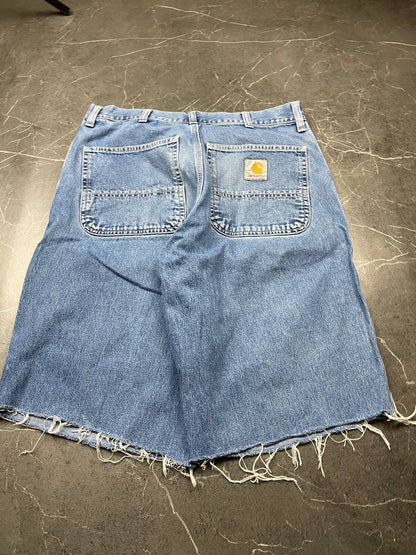 Carhartt blue denim skirt with multiple pockets and hammer loop detail.
