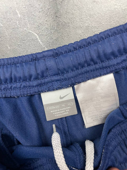 Nike blue sports shorts with white side stripes and small swoosh logo, zip pocket.