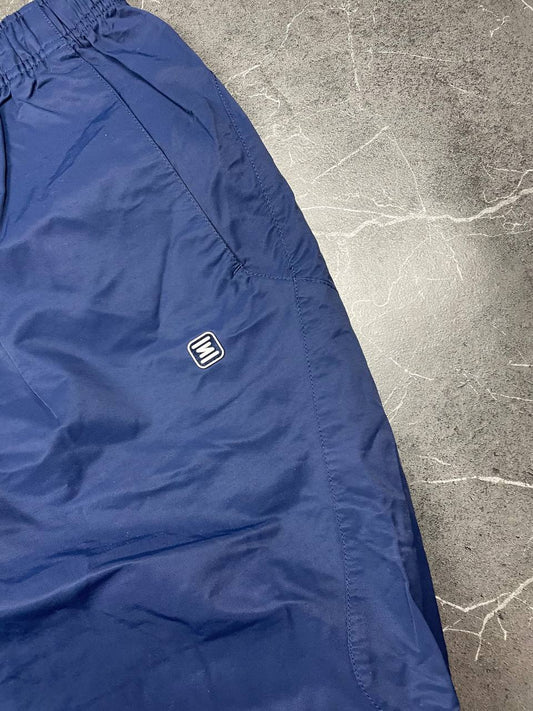 Nike blue woven shorts with elastic waistband, logo on front, and mesh lining.
