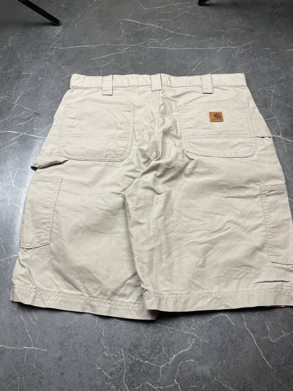 Carhartt beige work shorts 36-inch waist with multiple pockets and hammer loop detail.