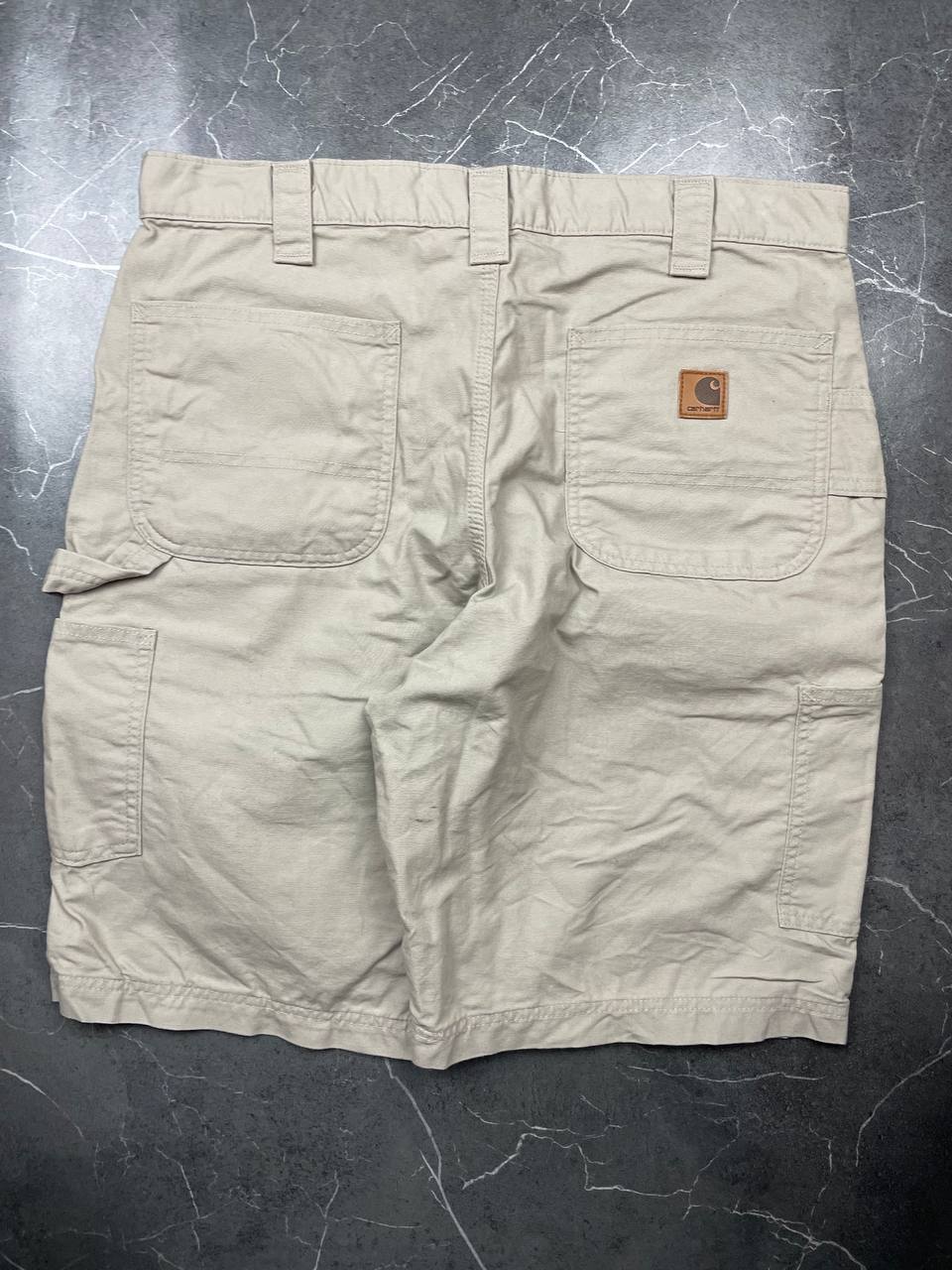 Carhartt beige work shorts 36-inch waist with multiple pockets and hammer loop detail.