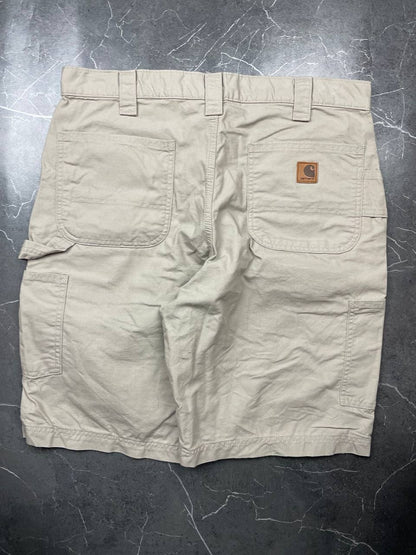Carhartt beige work shorts 36-inch waist with multiple pockets and hammer loop detail.
