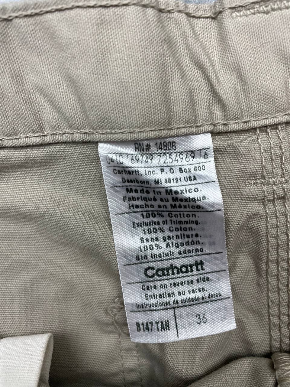 Carhartt beige work shorts 36-inch waist with multiple pockets and hammer loop detail.