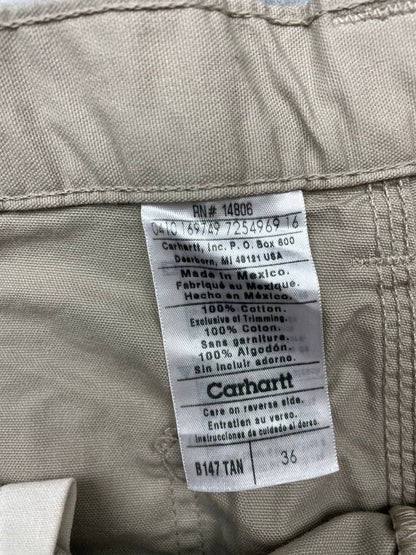 Carhartt beige work shorts 36-inch waist with multiple pockets and hammer loop detail.