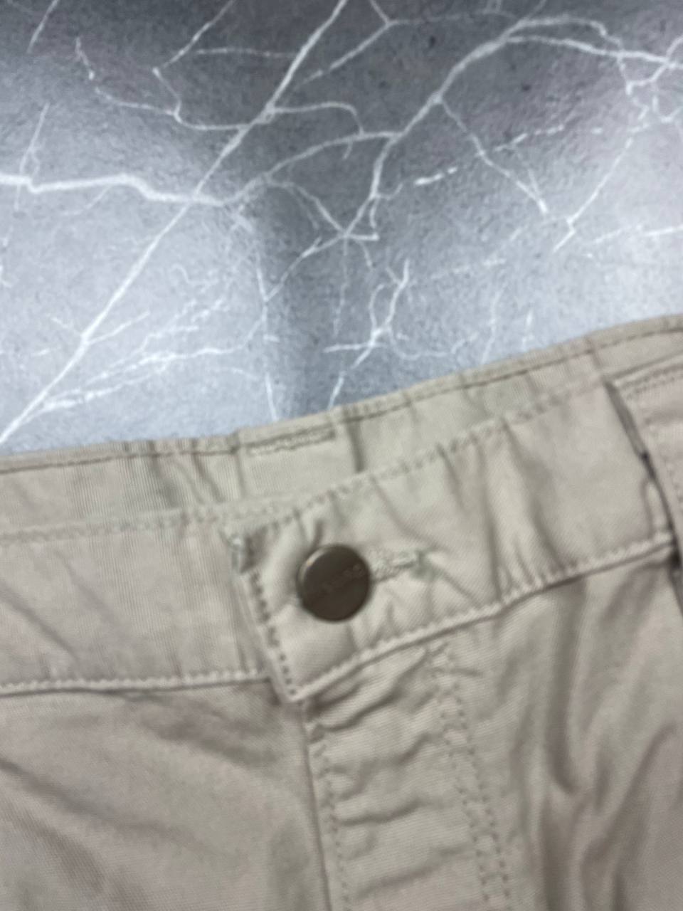 Carhartt beige work shorts 36-inch waist with multiple pockets and hammer loop detail.