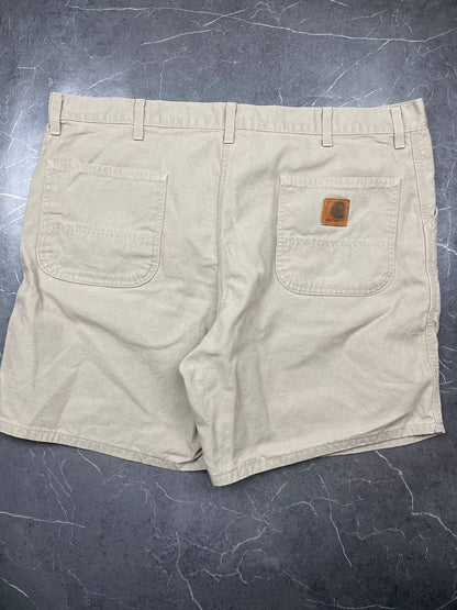 Carhartt beige cotton work shorts relaxed fit with logo patch and multiple pockets.