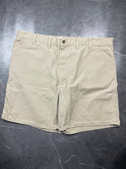 Carhartt beige cotton work shorts relaxed fit with logo patch and multiple pockets.