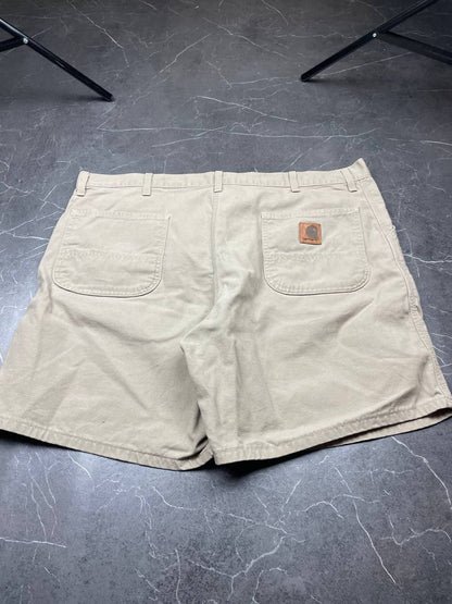 Carhartt beige cotton work shorts relaxed fit with logo patch and multiple pockets.