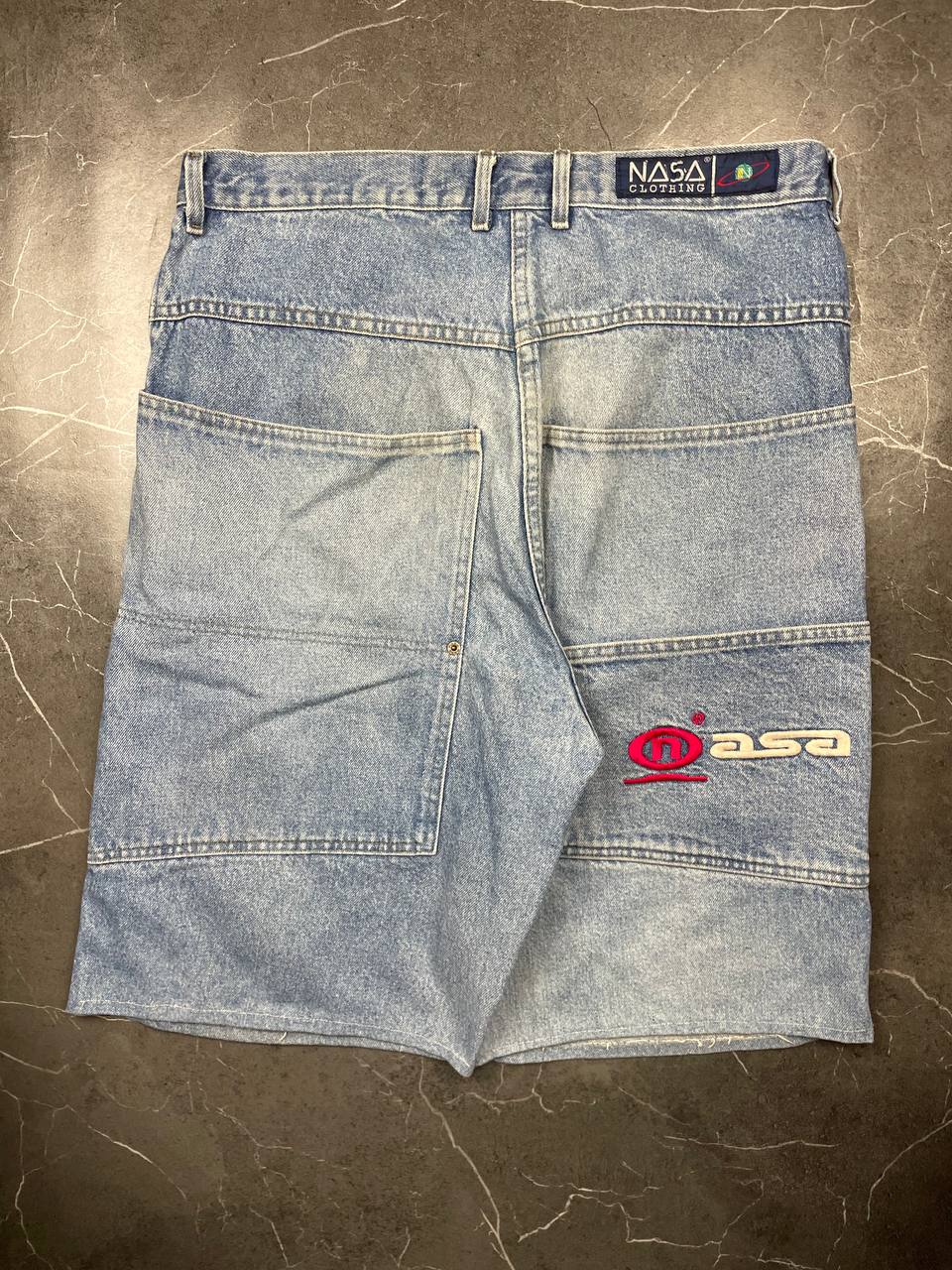 NASA Clothing light blue denim shorts with embroidered logo and classic 5-pocket styling.