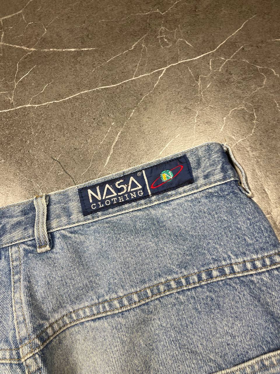 NASA Clothing light blue denim shorts with embroidered logo and classic 5-pocket styling.